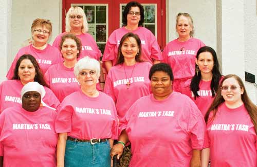 Group of volunteers and the women they help at Martha's Task.